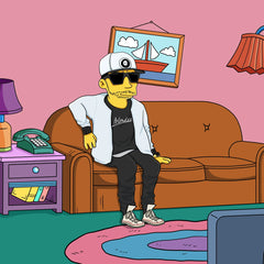Man in a cap and sunglasses sitting on the couch in cartoon style